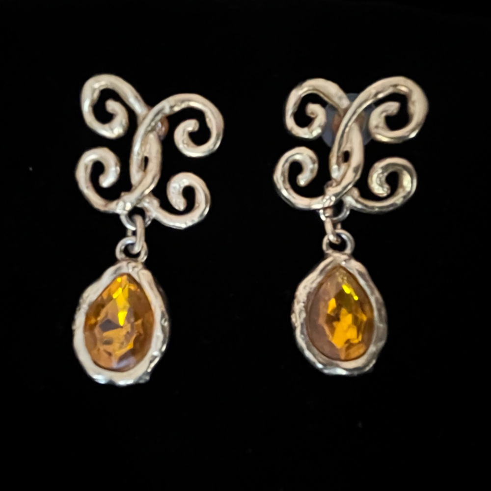 Gold colored earrings with deep yellow stones